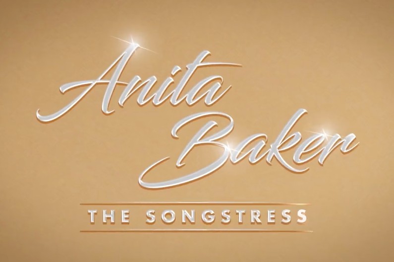 A tan background with white lettering and the words anita baker.