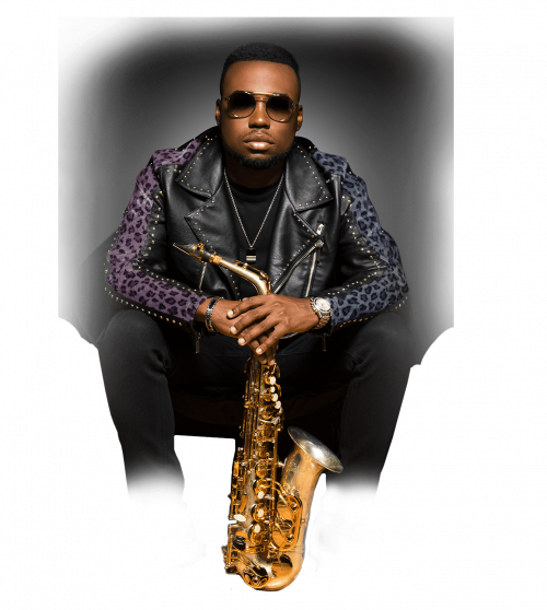 A man sitting down with his saxophone
